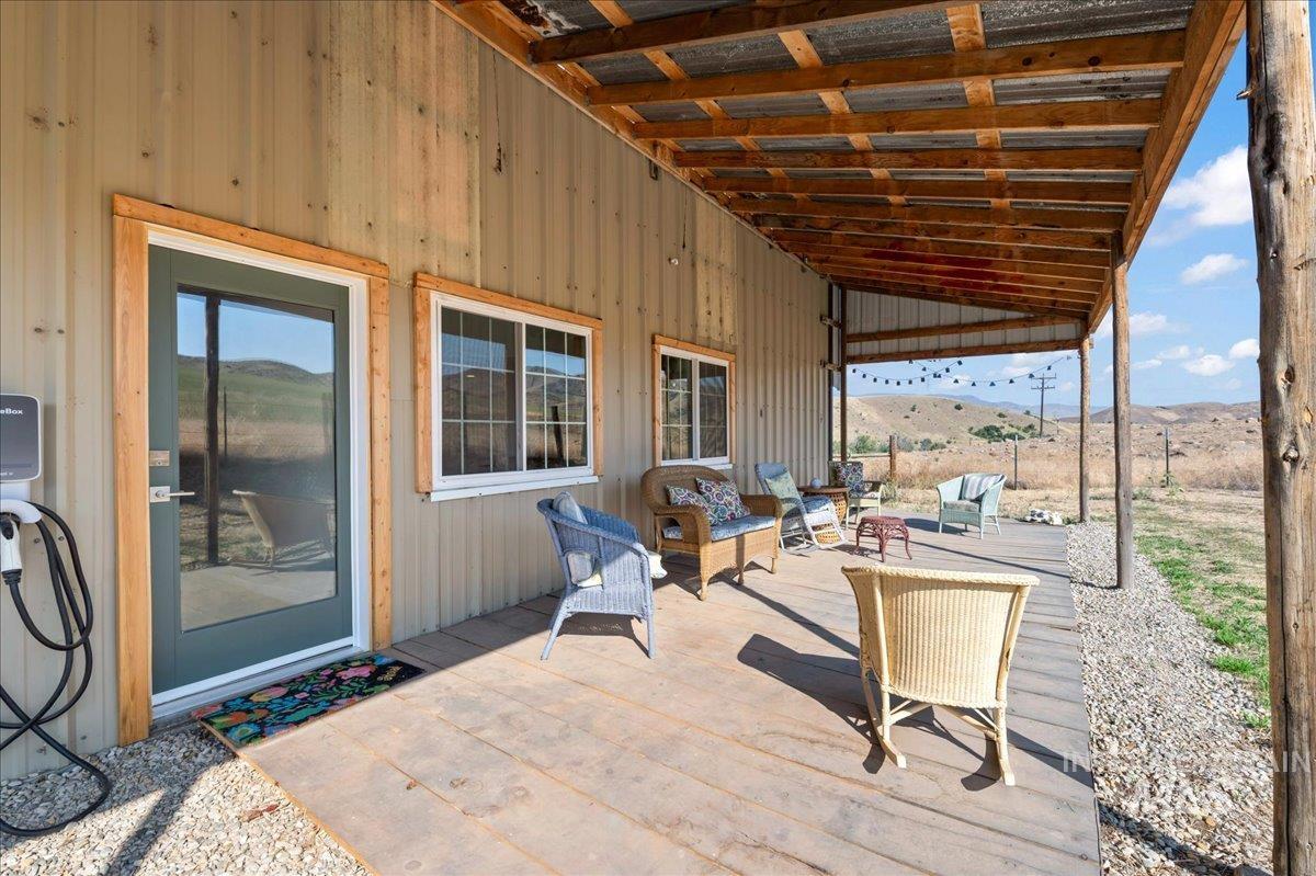 View of patio / terrace with an outdoor hangout area and a deck with mountain view from the ADU