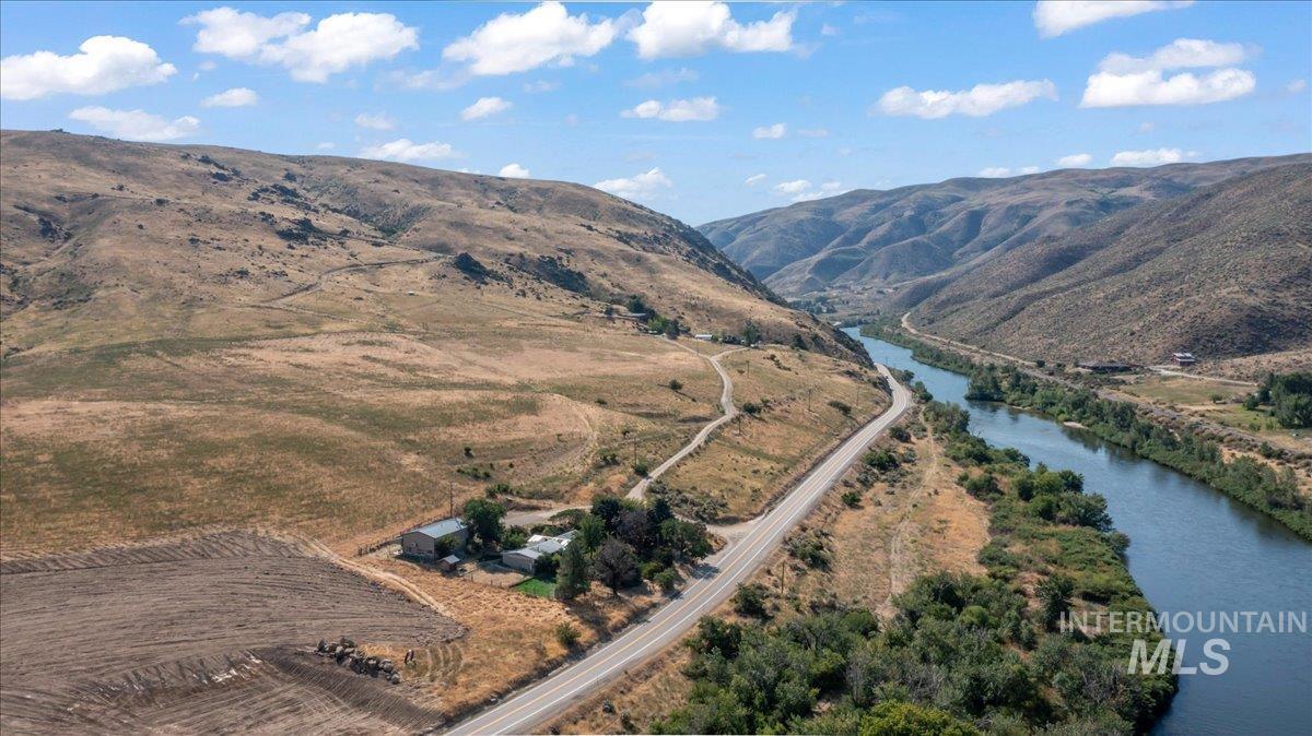 Aerial overview of property's location featuring the river accross the highway.