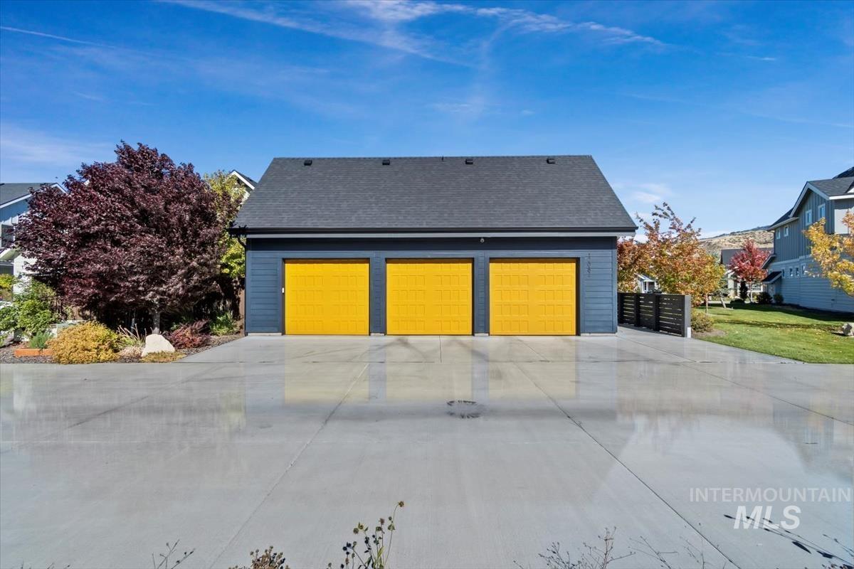 View of front of property with roof with shingles