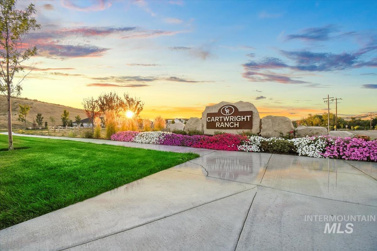 View of property's community featuring a yard