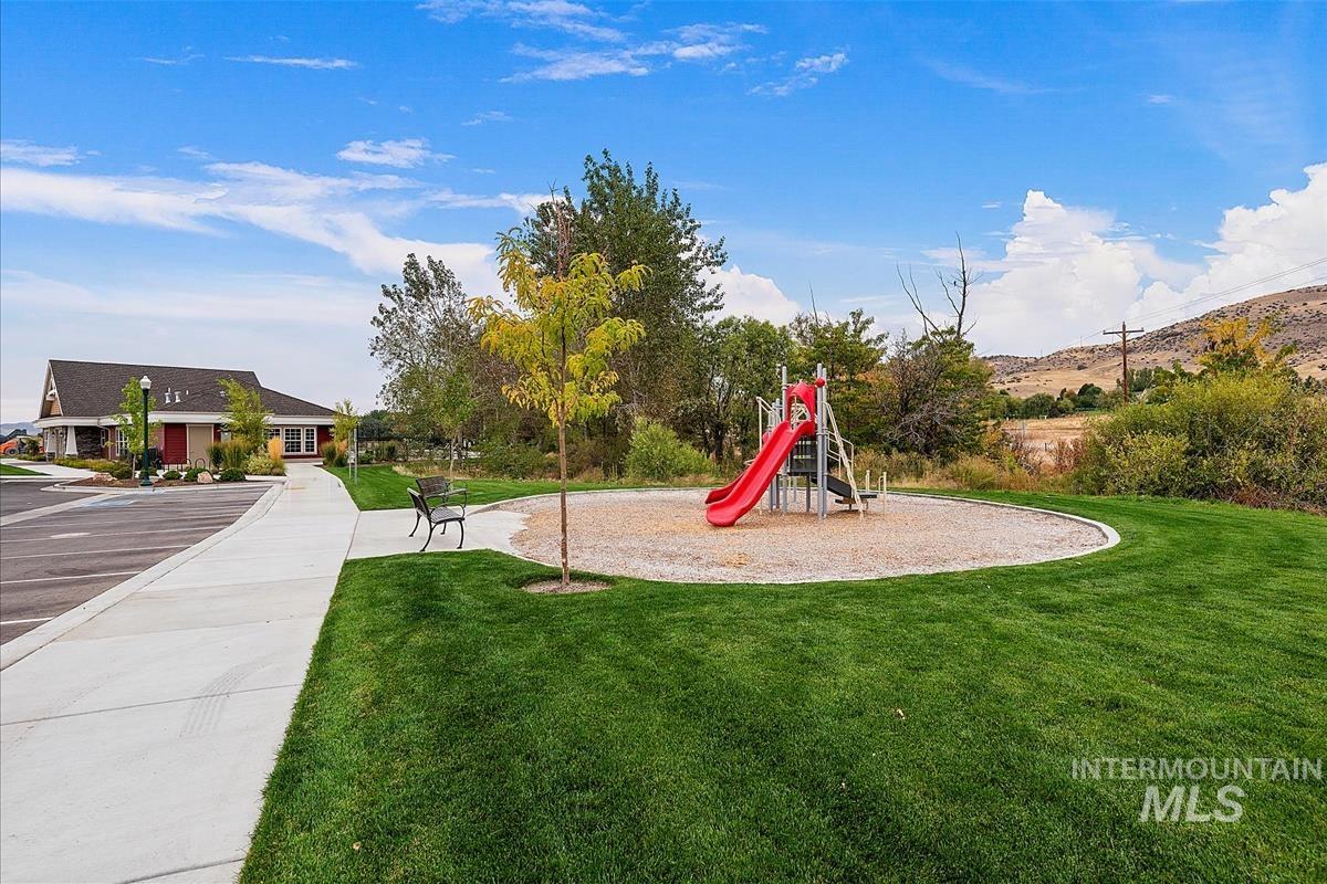 Community jungle gym with a yard