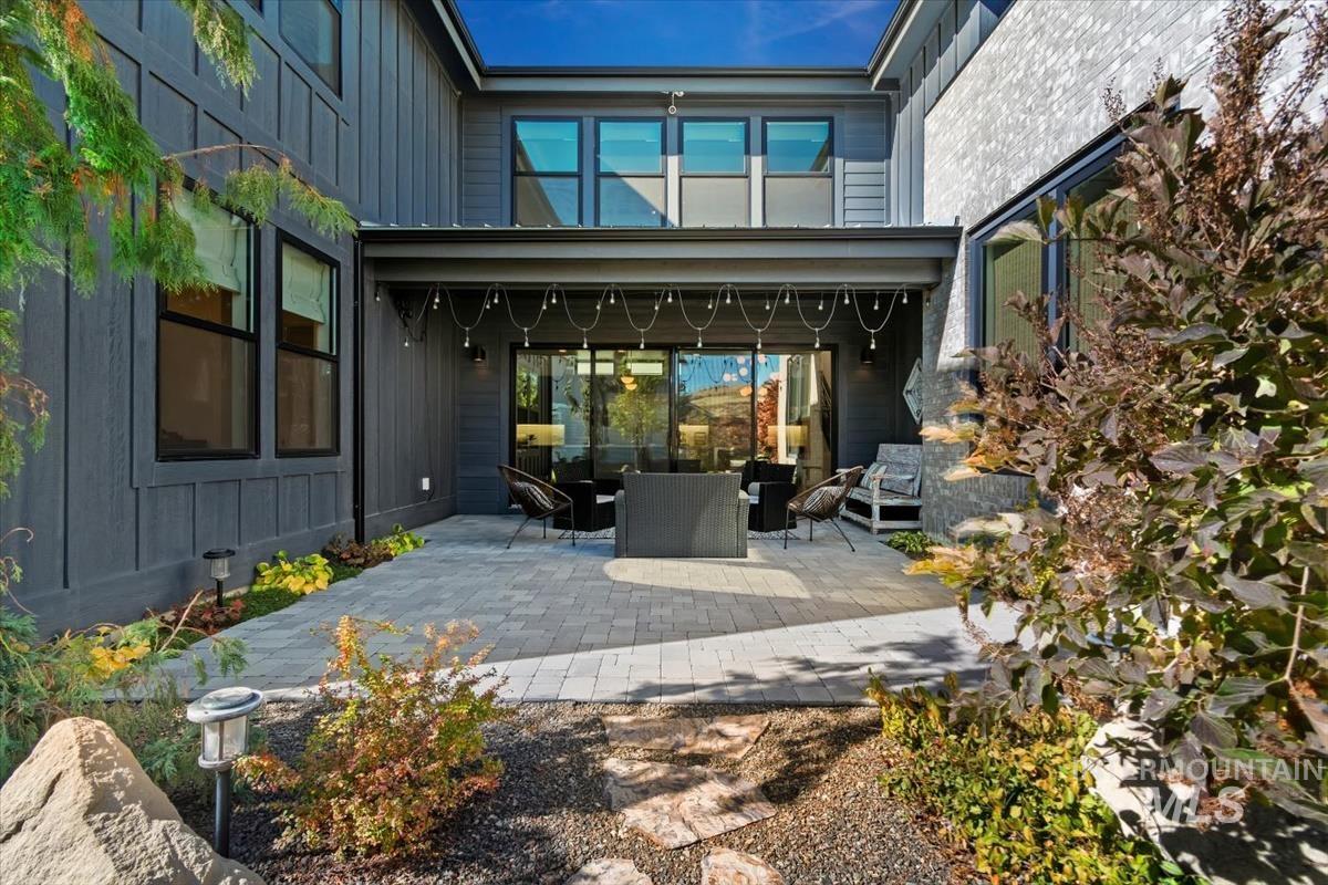 Rear view of property with a patio and outdoor lounge area