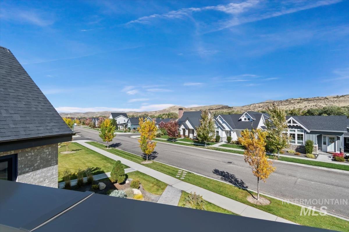 Exterior space with nearby suburban area and a mountain backdrop