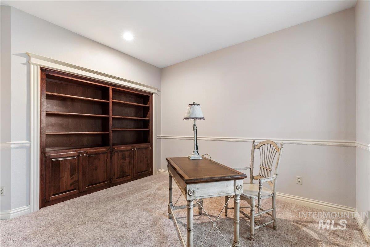 Home office with carpet flooring
