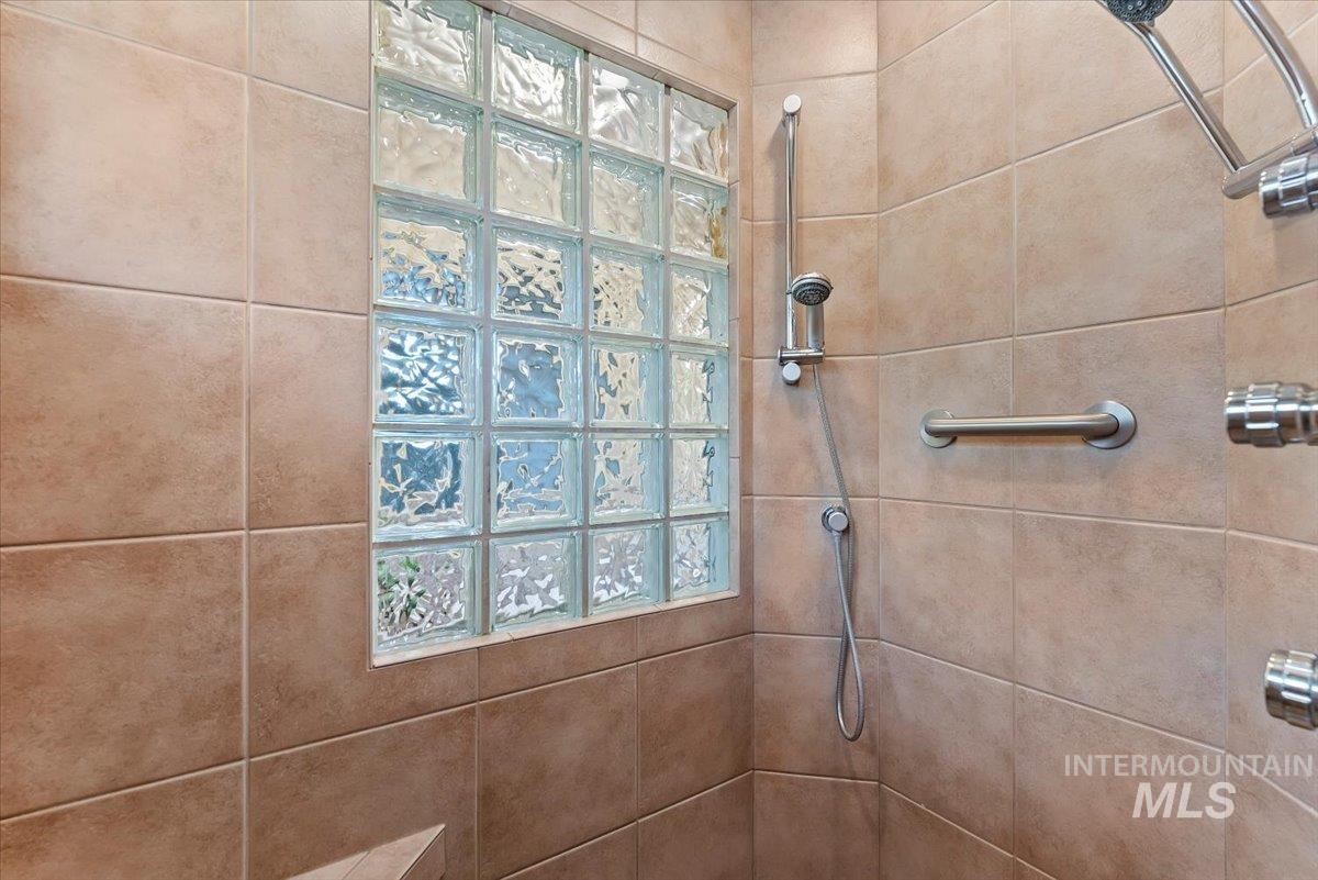 Bathroom featuring a tile shower