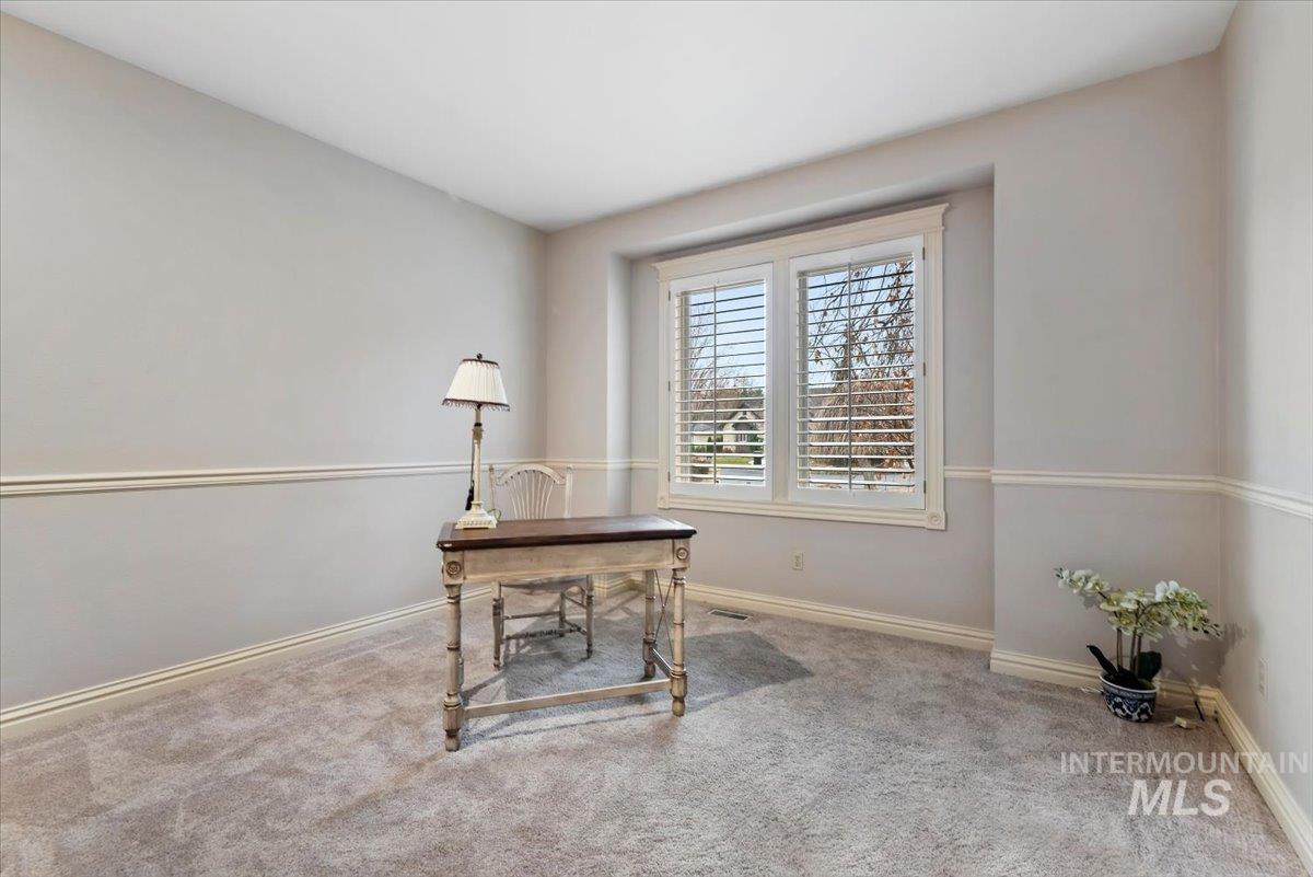 Office with carpet and baseboards