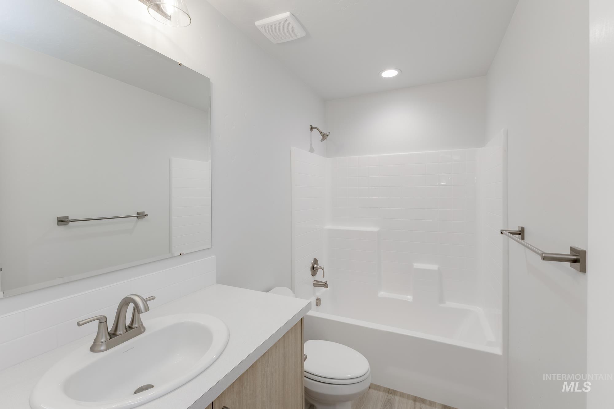 Bathroom featuring vanity and tub / shower combination