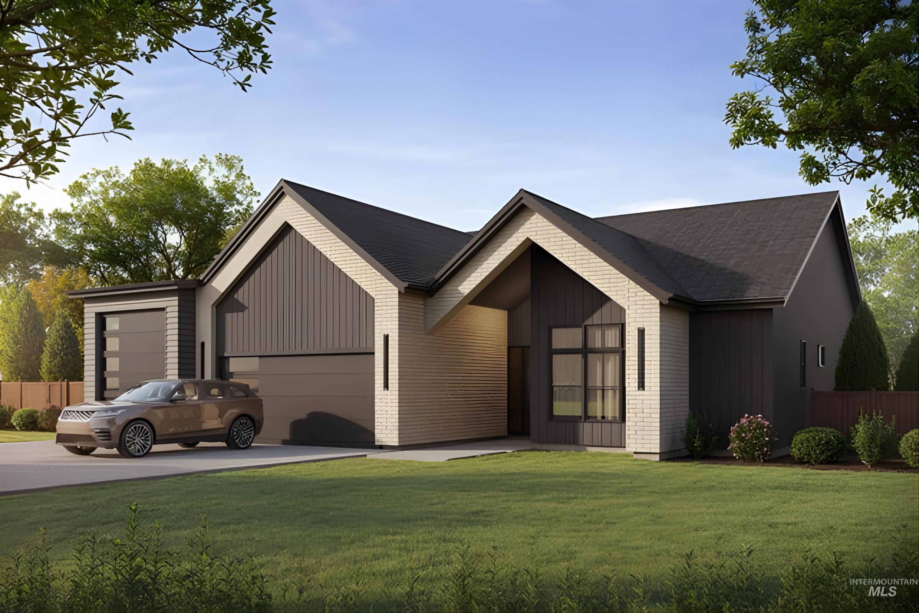 View of front of house featuring driveway and a garage