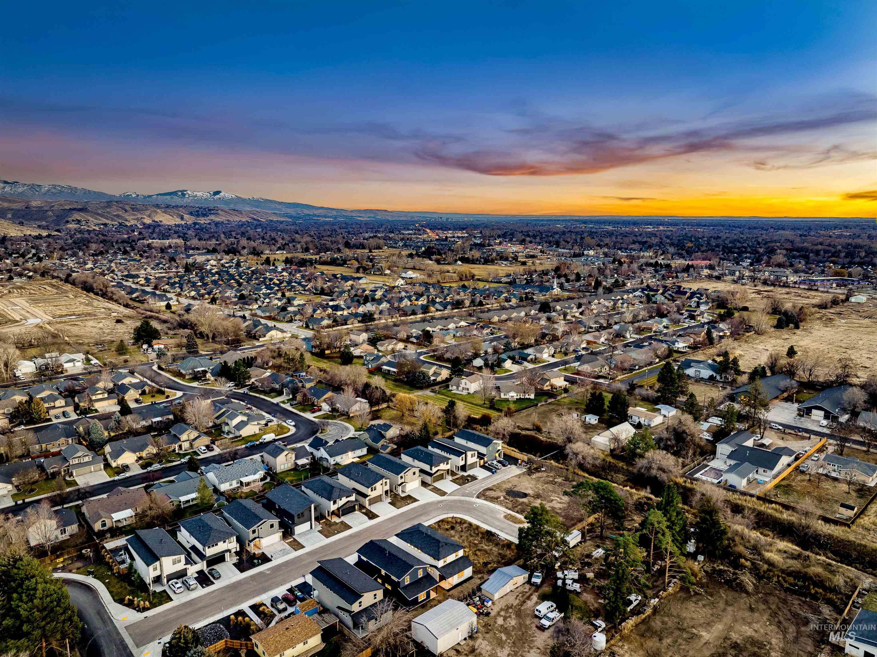 Aerial overview of property's location with nearby suburban area