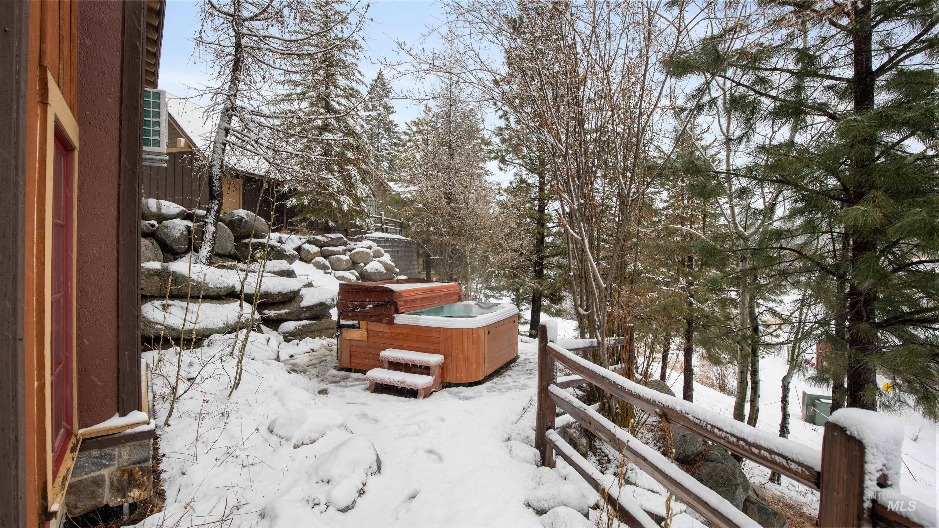 View of yard featuring a deck and a hot tub