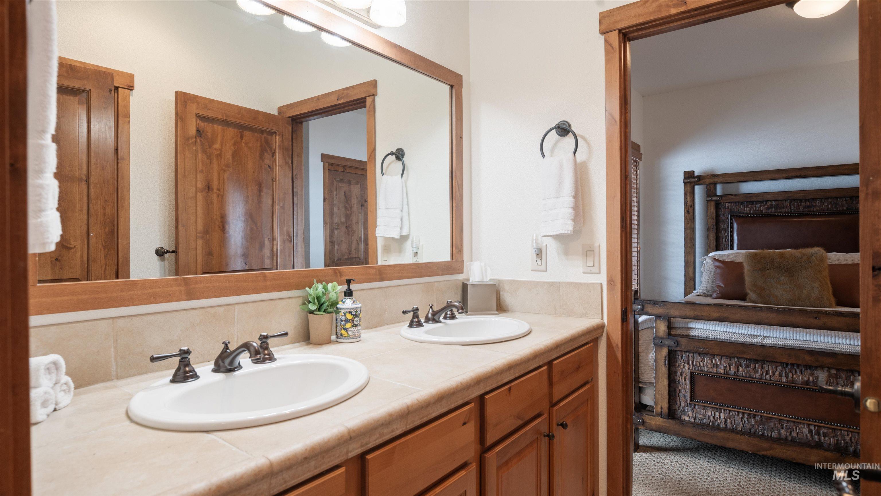 Bathroom featuring double vanity