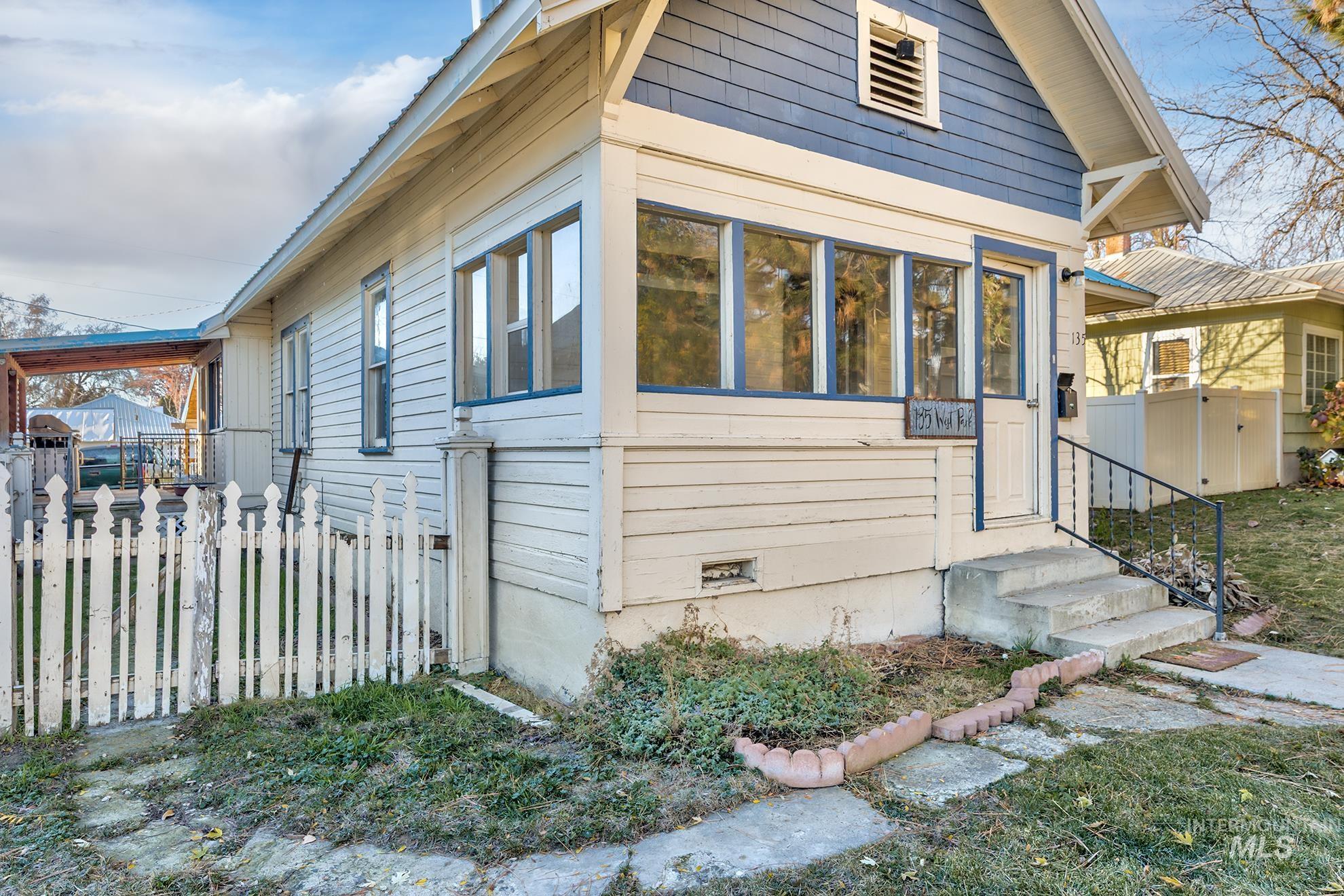 View of side of home featuring crawl space and entry steps