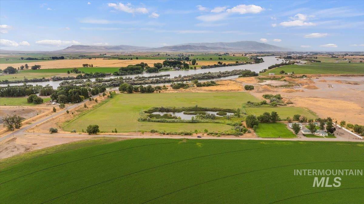 Overview of rural landscape featuring a water and mountain view