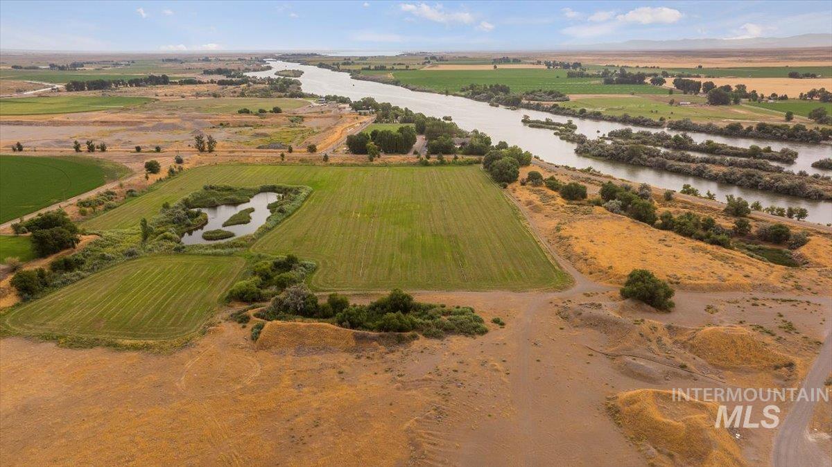 Aerial overview of property's location featuring a nearby body of water and rural landscape