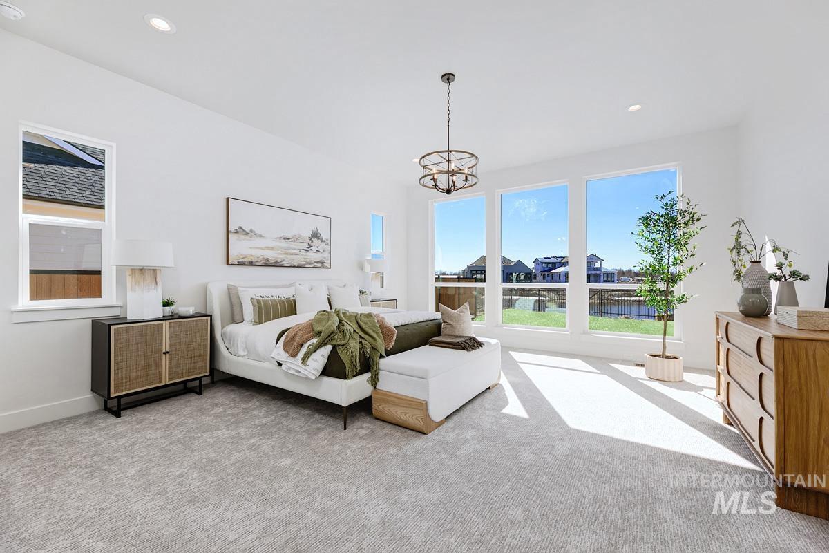 Bedroom with recessed lighting, carpet, and a chandelier