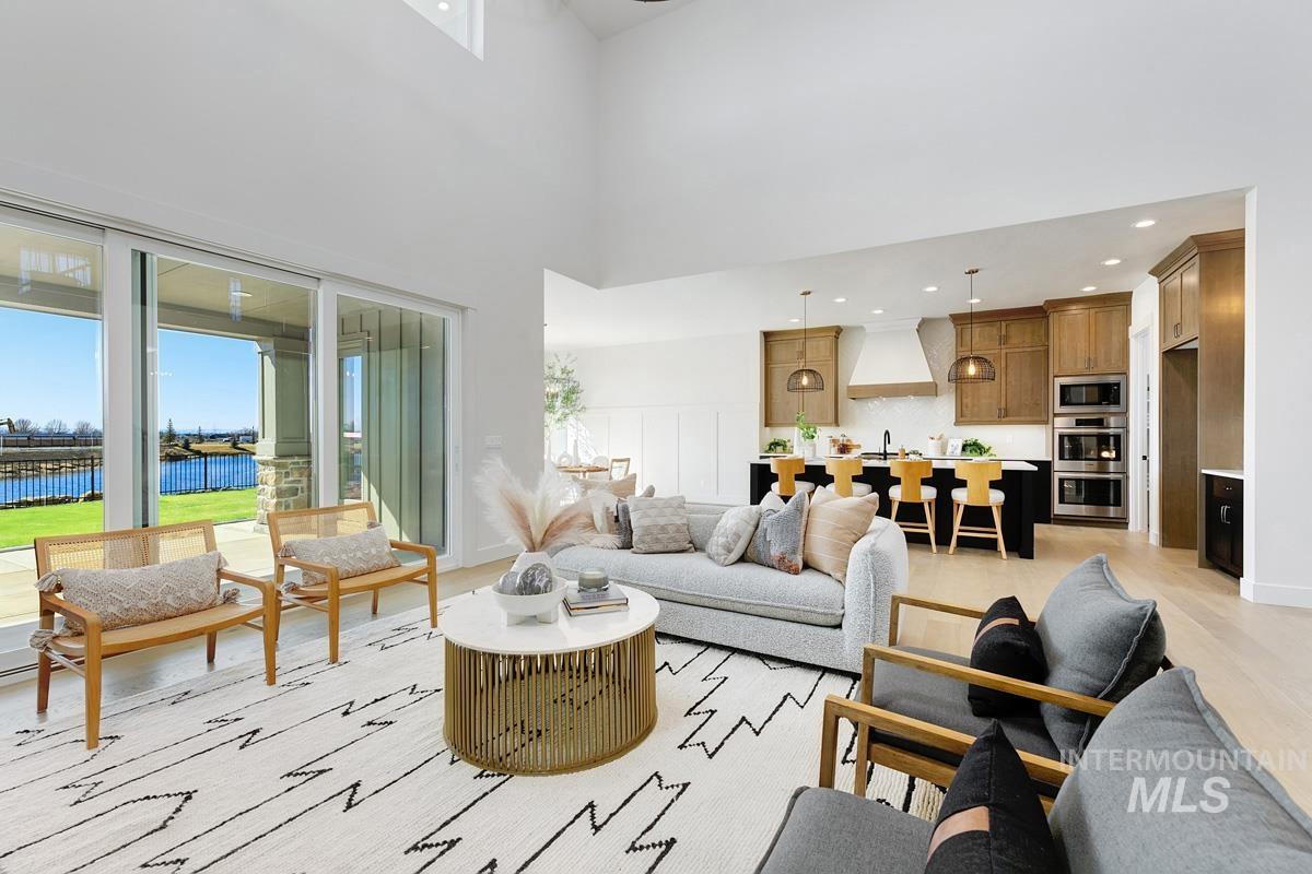 Living room with a water view and a high ceiling