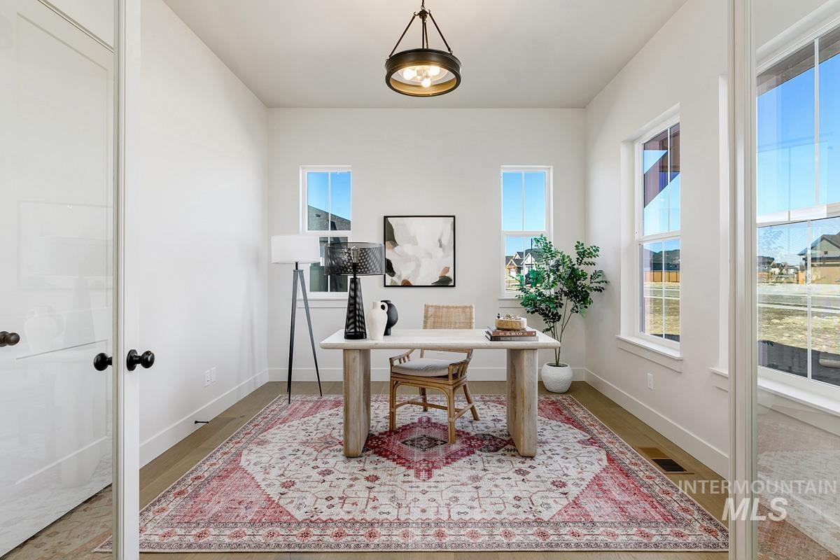 Home office featuring wood finished floors