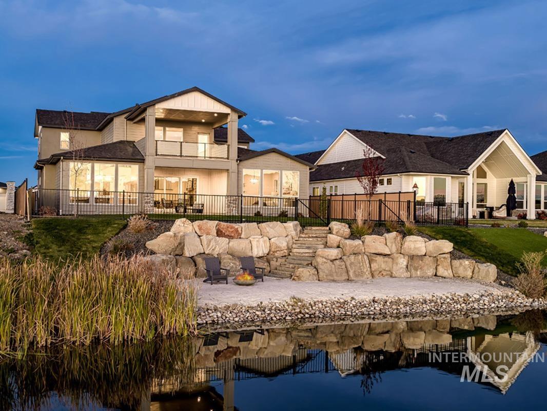 Rear view of house with a patio, a balcony, and a fenced backyard