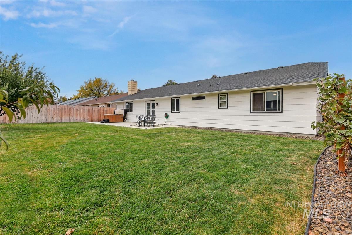 Back of property featuring a patio area and a chimney