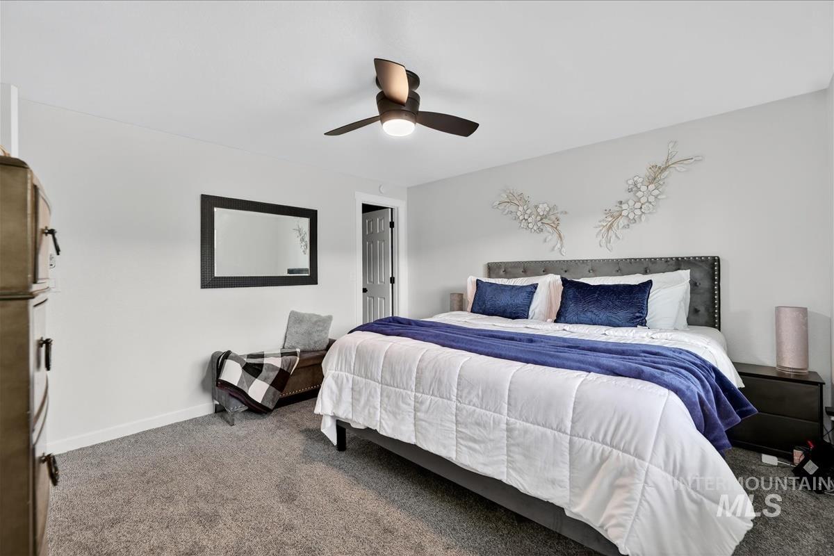 Bedroom featuring carpet and a ceiling fan