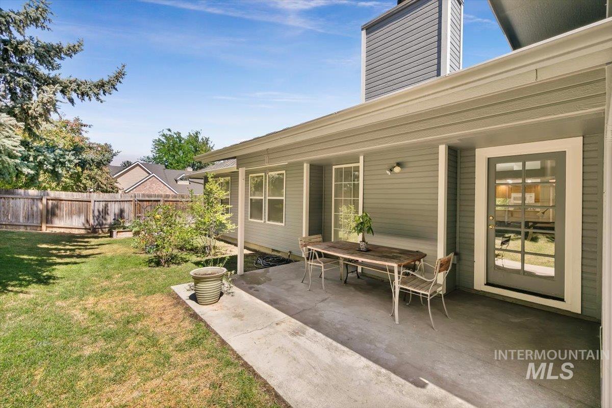 View of yard with a patio and outdoor dining space