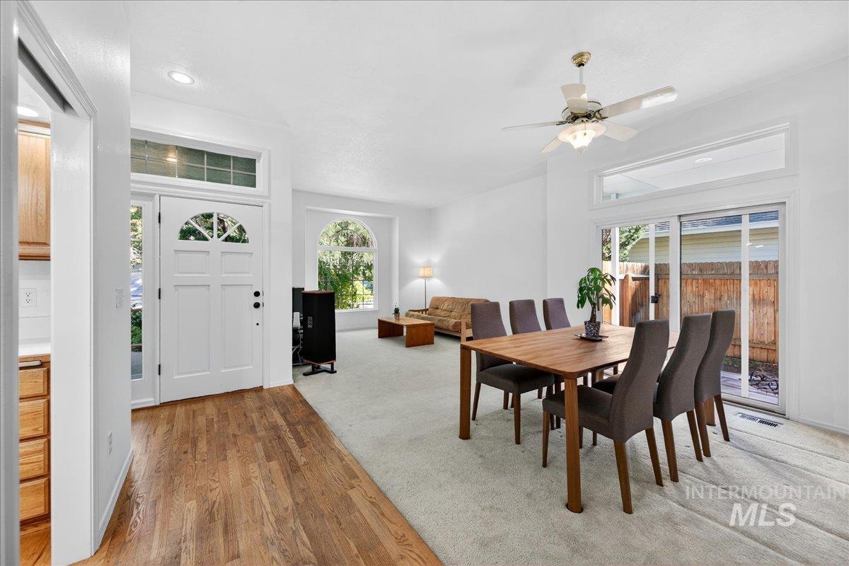 Dining room with plenty of natural light, light wood-type flooring, recessed lighting, and ceiling fan