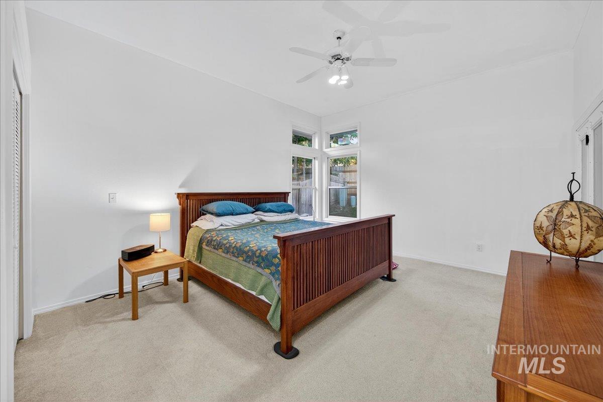 Bedroom with carpet flooring and a ceiling fan