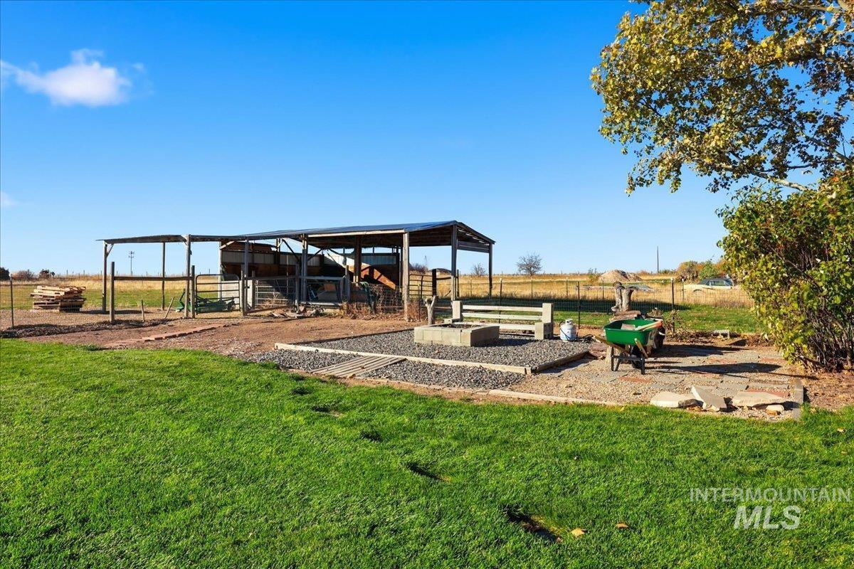 View of yard with an outbuilding and a patio area