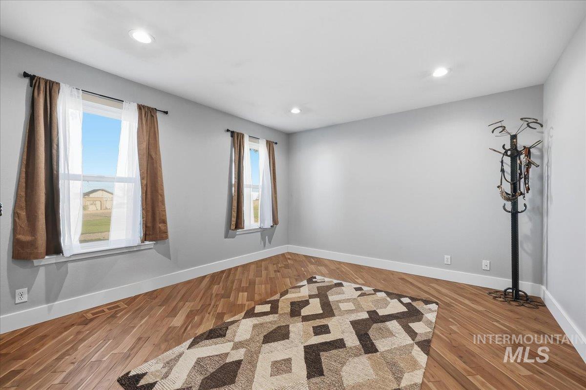 Unfurnished room featuring light wood finished floors and recessed lighting