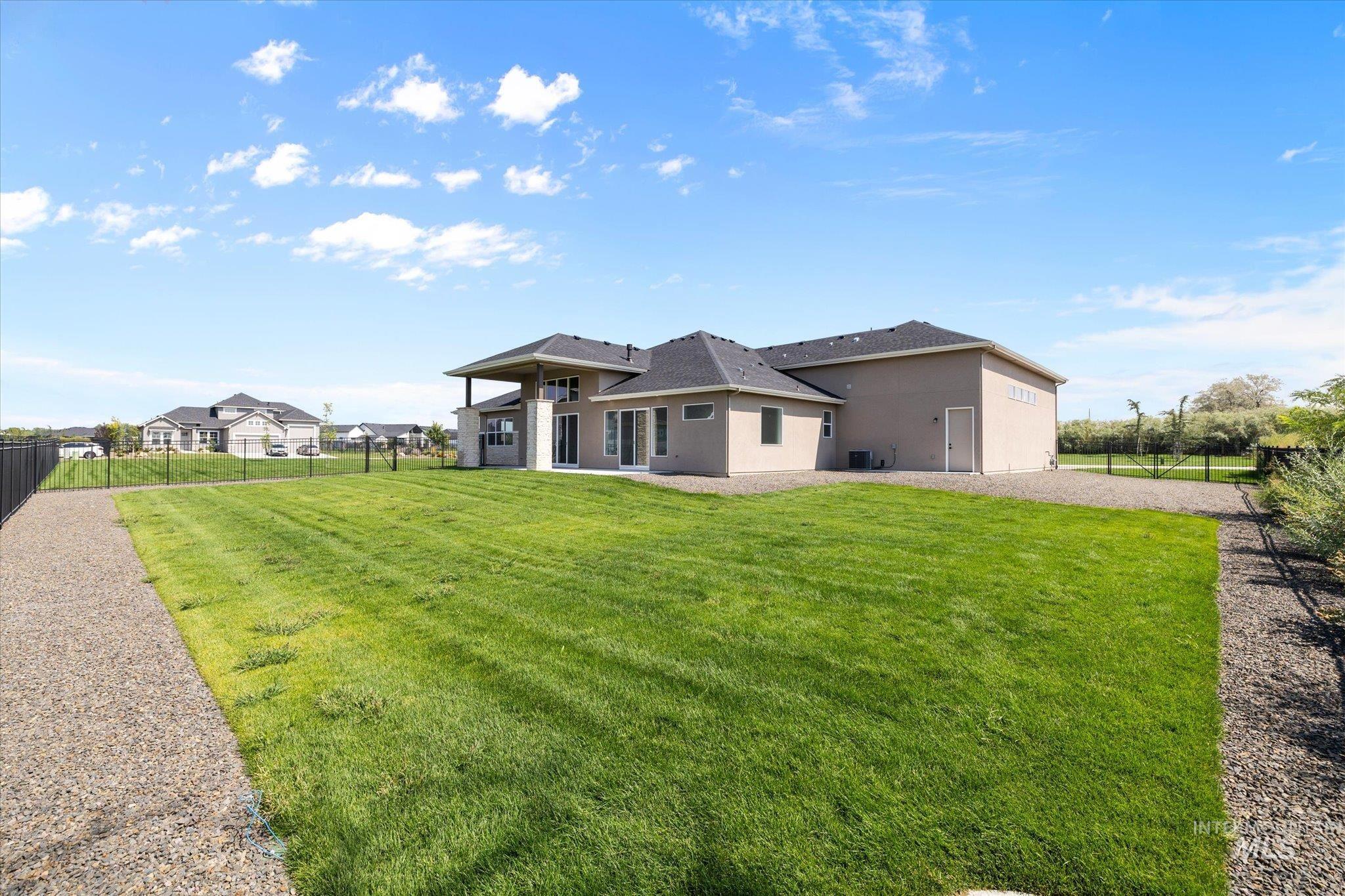 Back of property featuring a patio and stucco siding