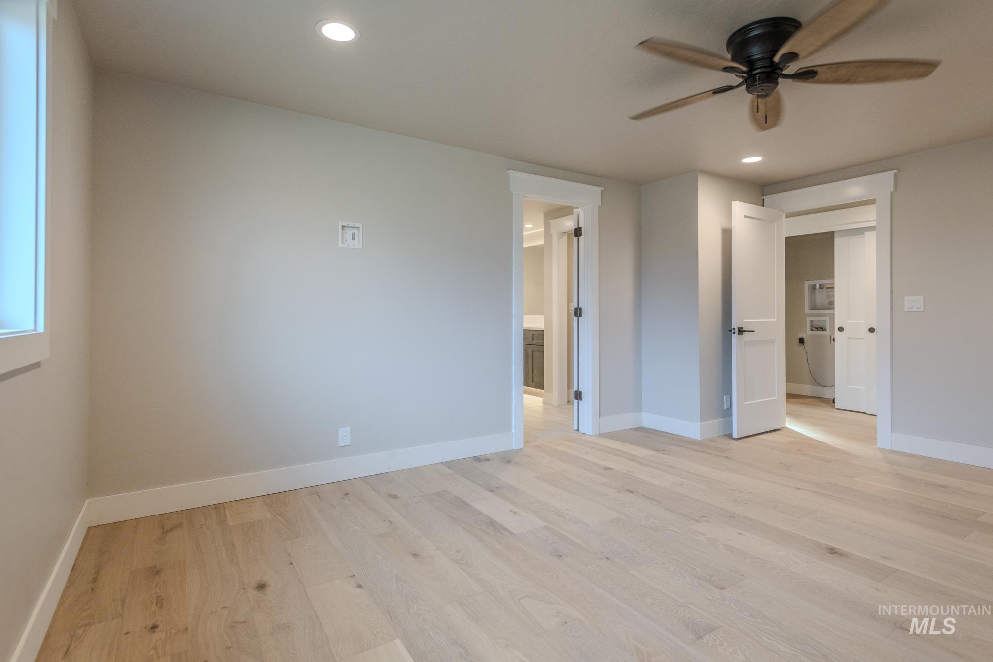 Light wood flooring, recessed lighting, ceiling fan, walk in closet, and huge master bath with wet-room.
