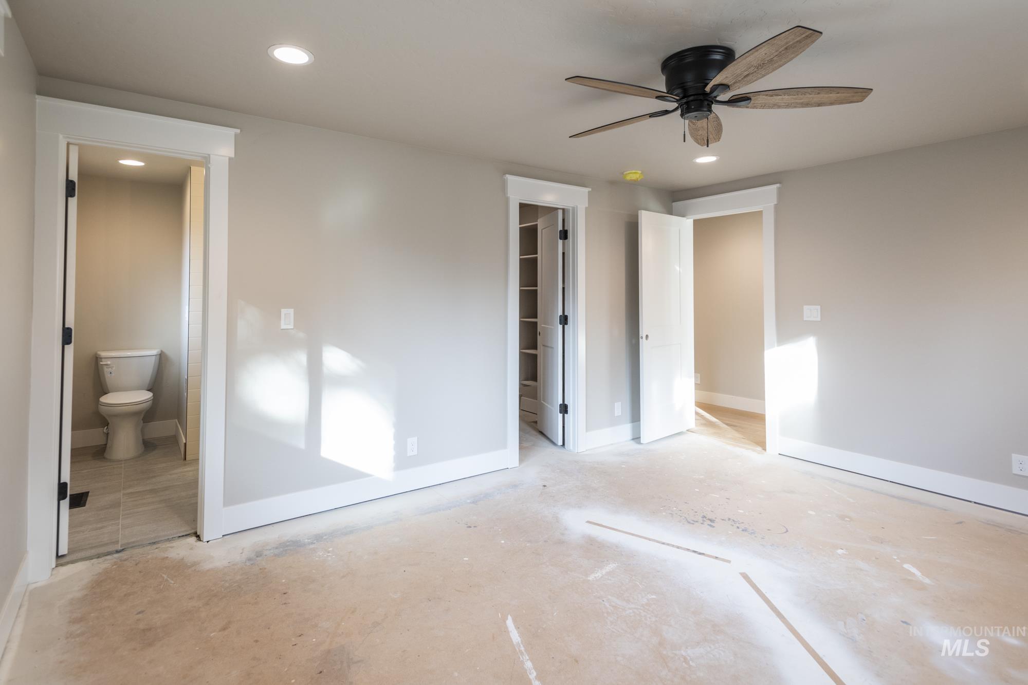 2nd primary bedroom featuring a walk in closet, recessed lighting, a ceiling fan, and ensuite bath