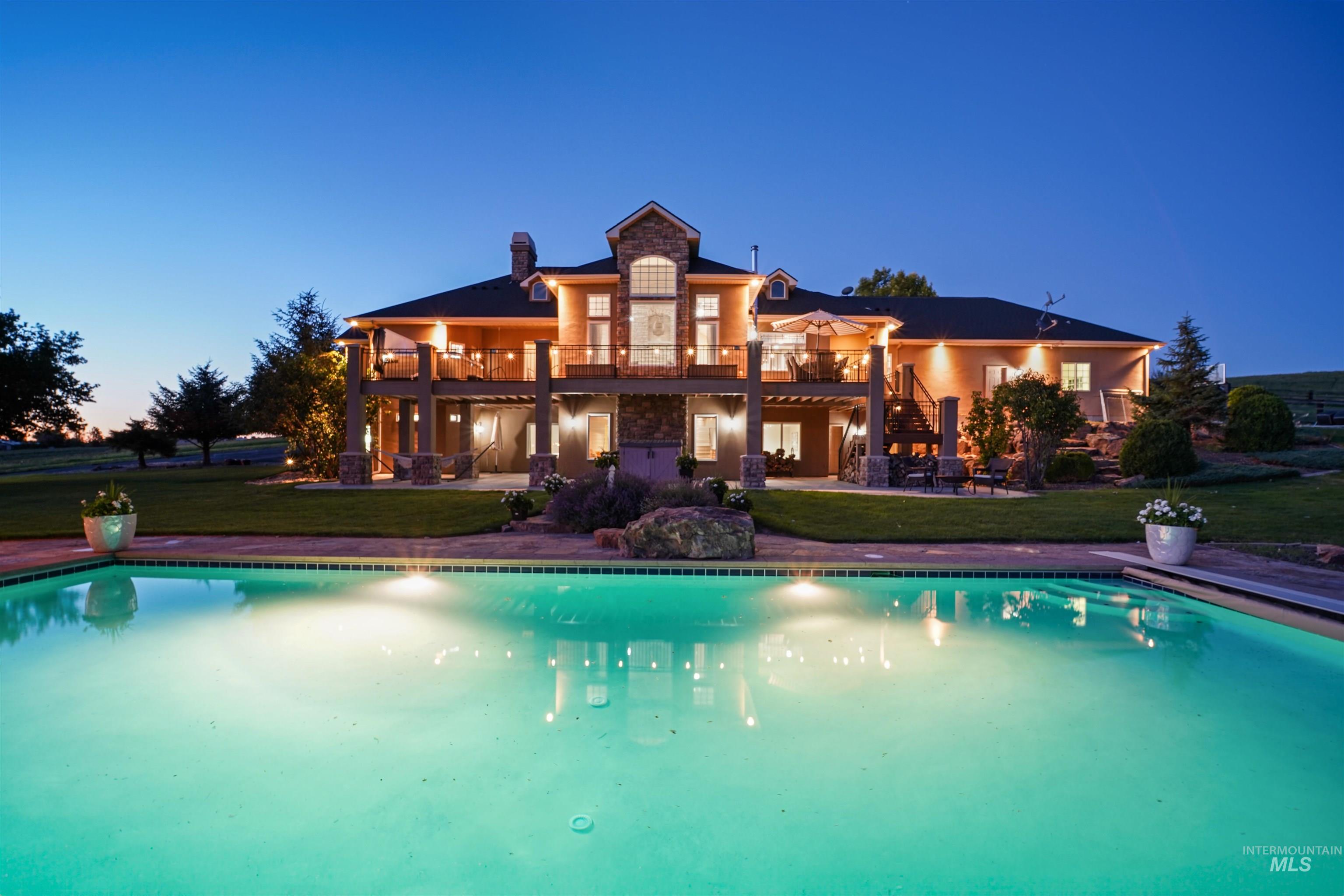 Outdoor pool featuring stairway, a patio area, a yard, and a wooden deck