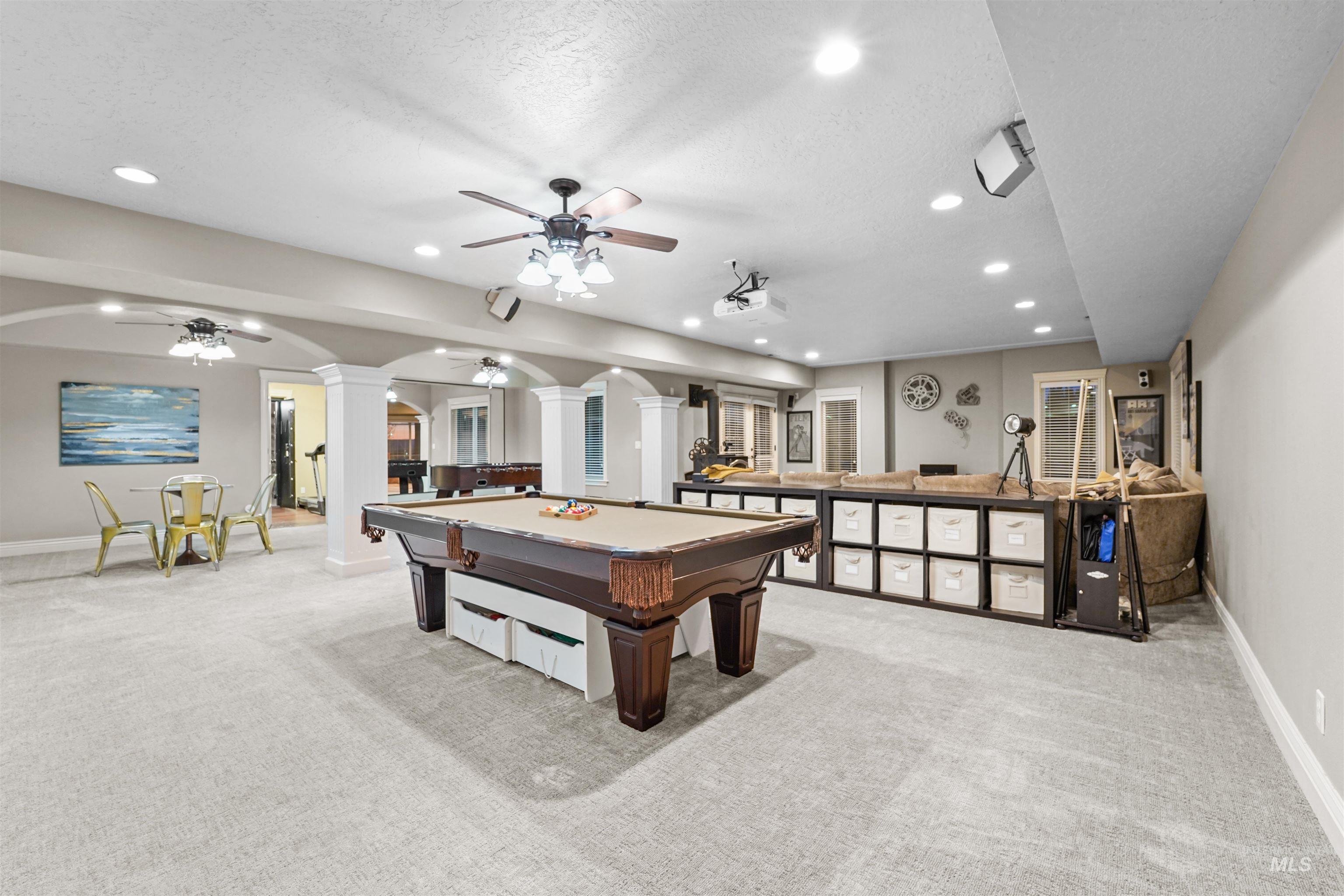 Rec room with ornate columns, recessed lighting, arched walkways, billiards, and a ceiling fan
