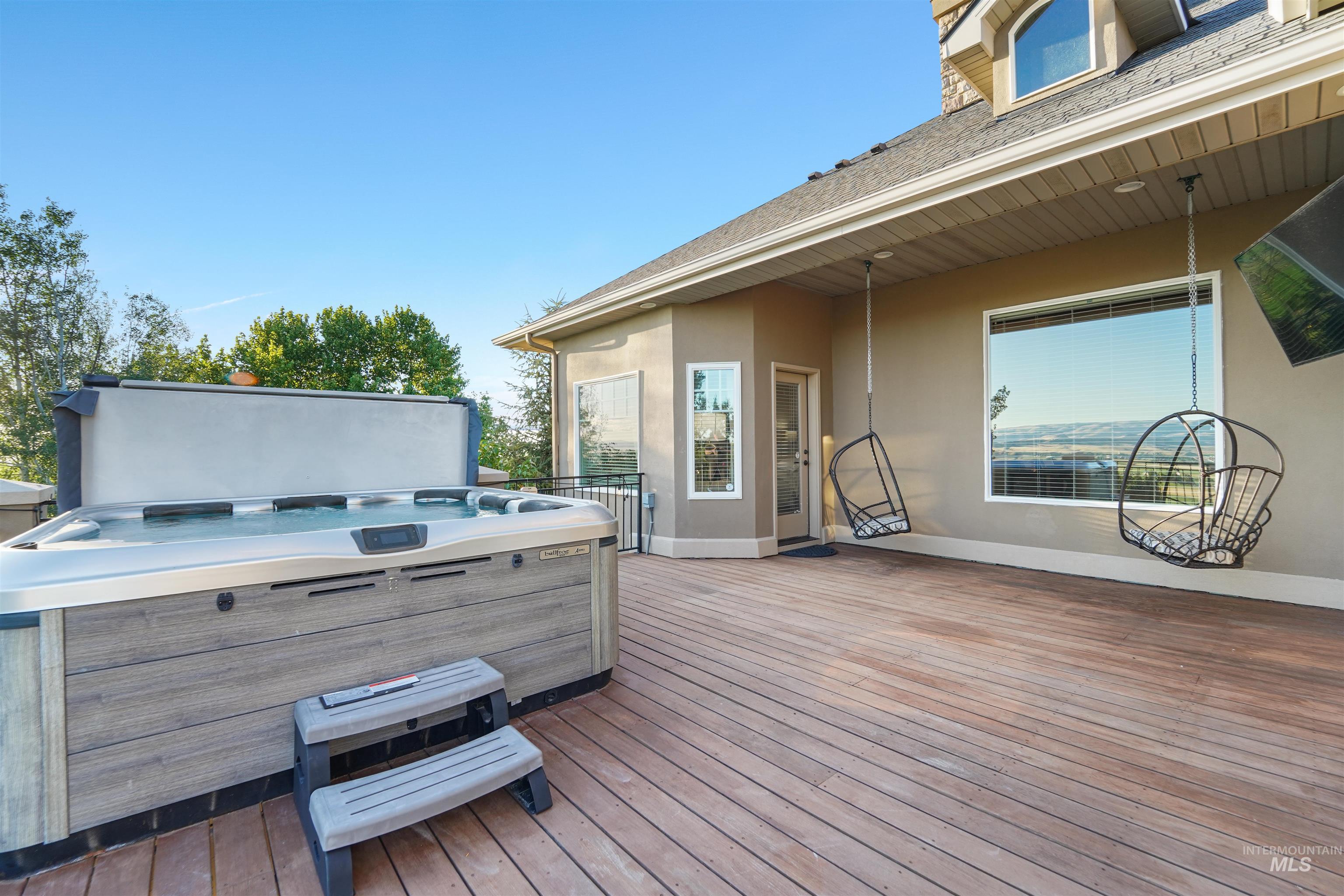 Wooden terrace with a hot tub
