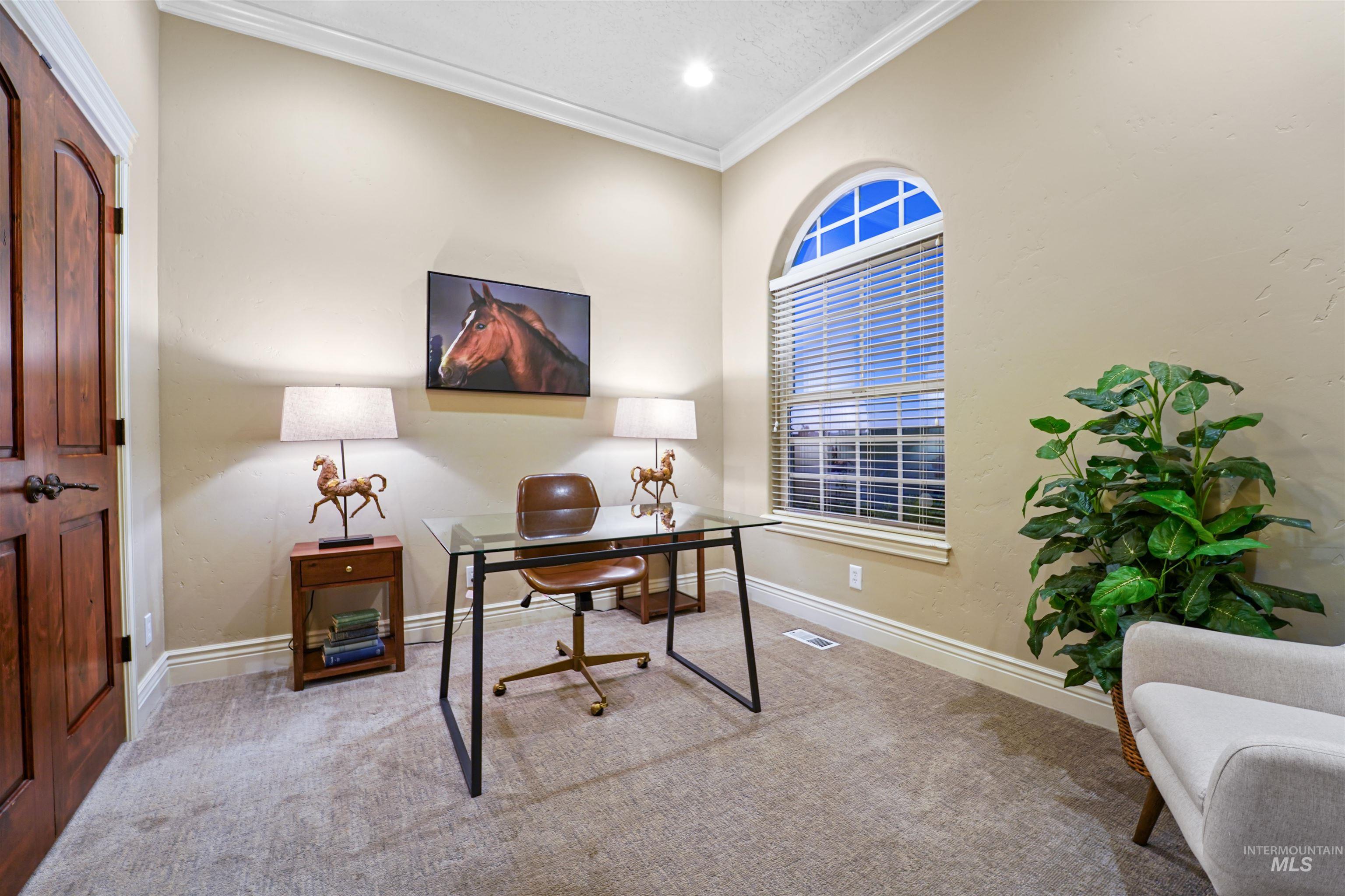 Carpeted office space with crown molding, recessed lighting, and a textured ceiling