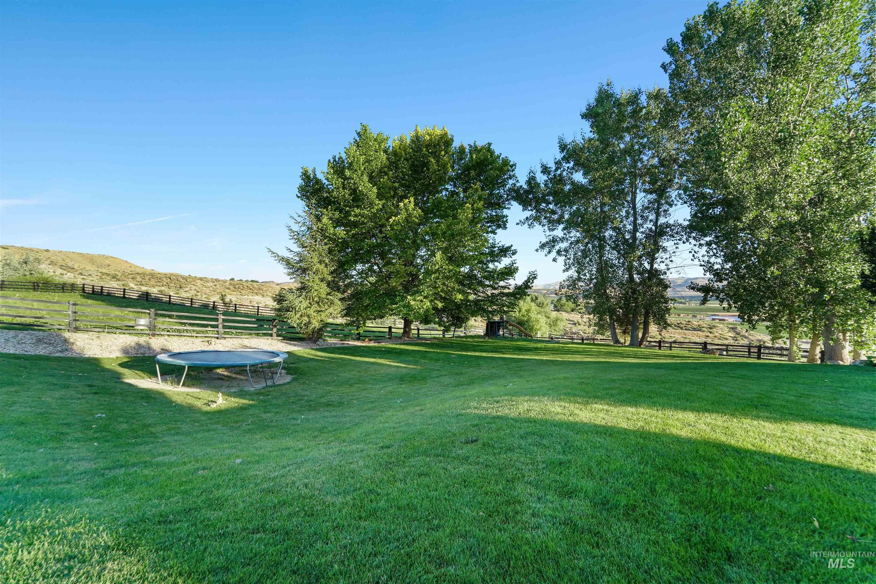 View of yard featuring a trampoline