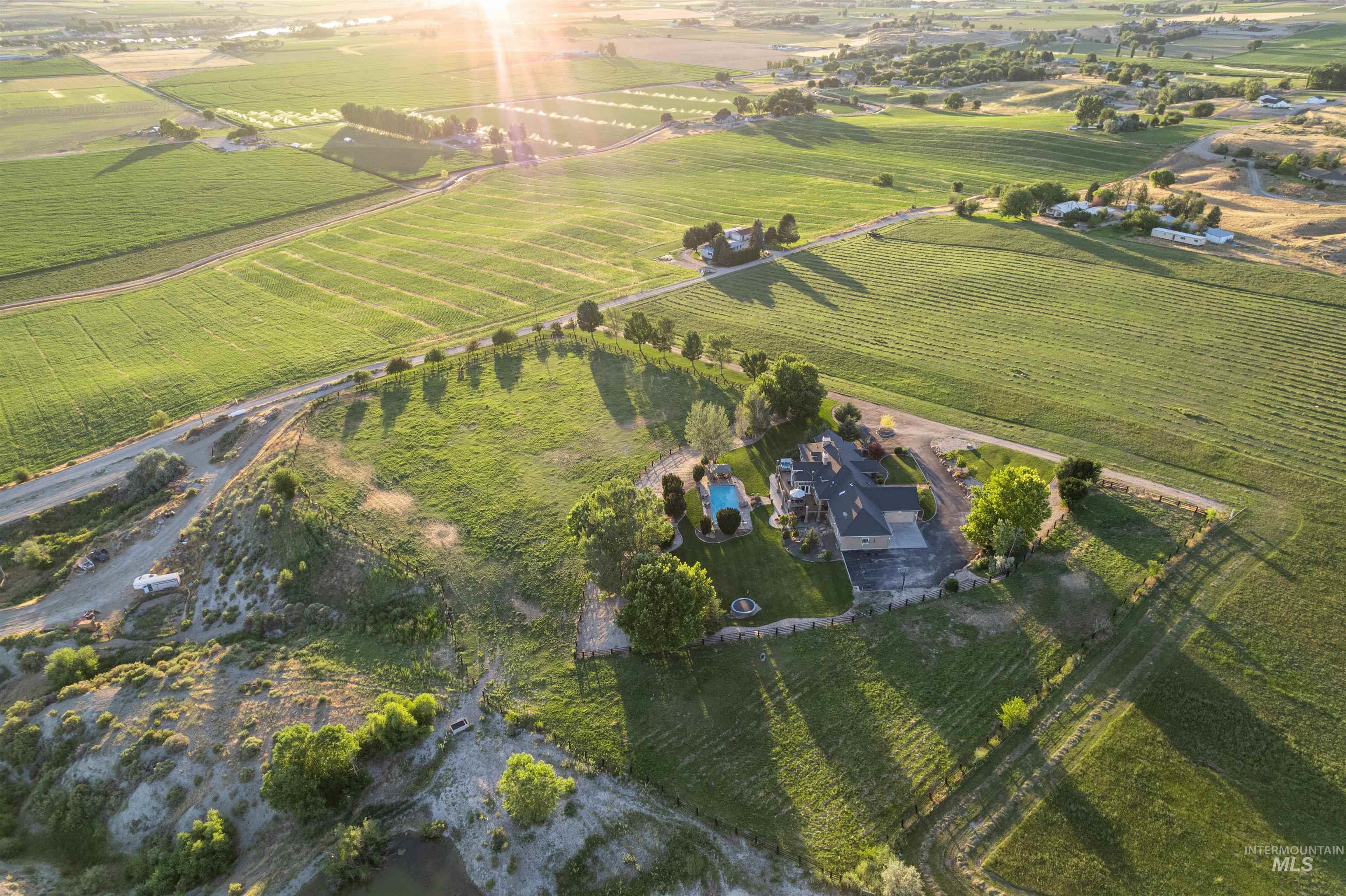 Aerial view of property's location featuring rural landscape and rows of crops