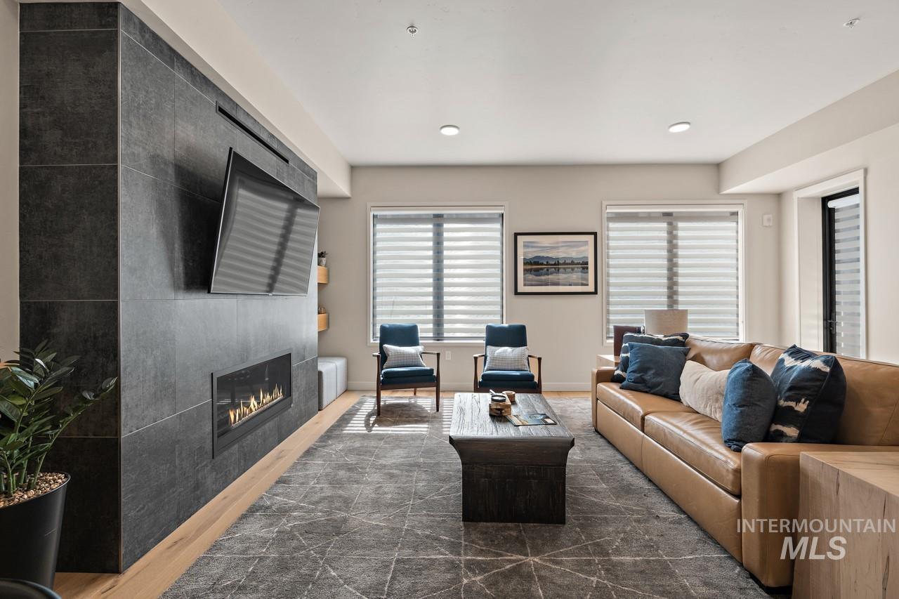 Living room featuring a fireplace and recessed lighting