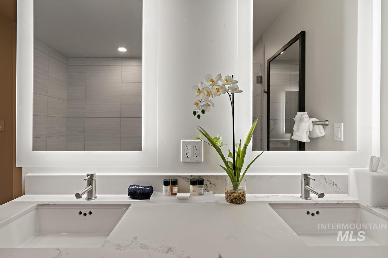 Bathroom with recessed lighting and double vanity