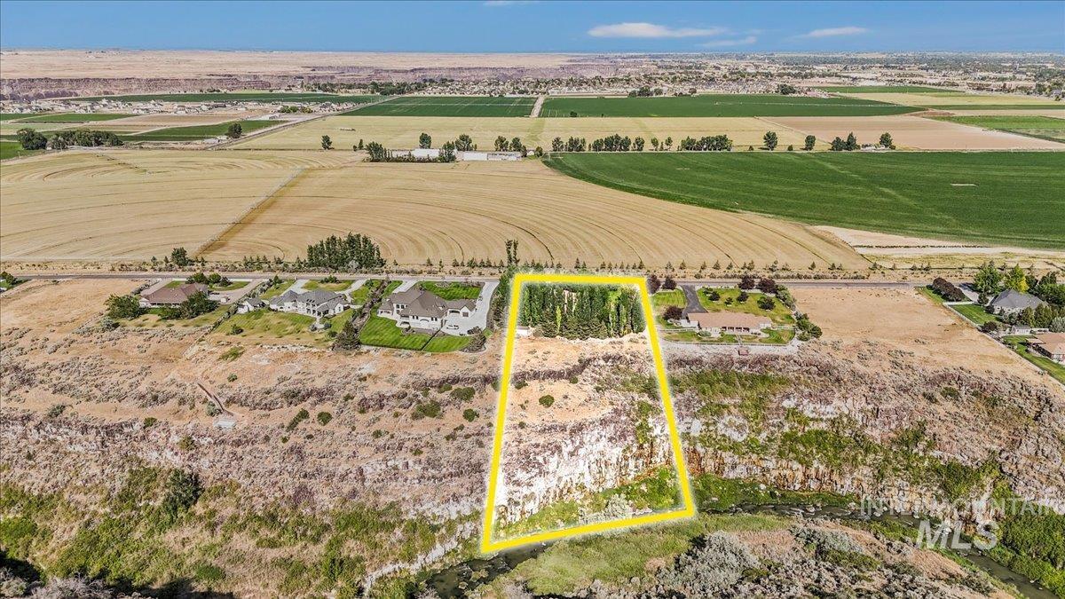 Aerial view of sparsely populated area with abundant farmland and property boundaries highlighted