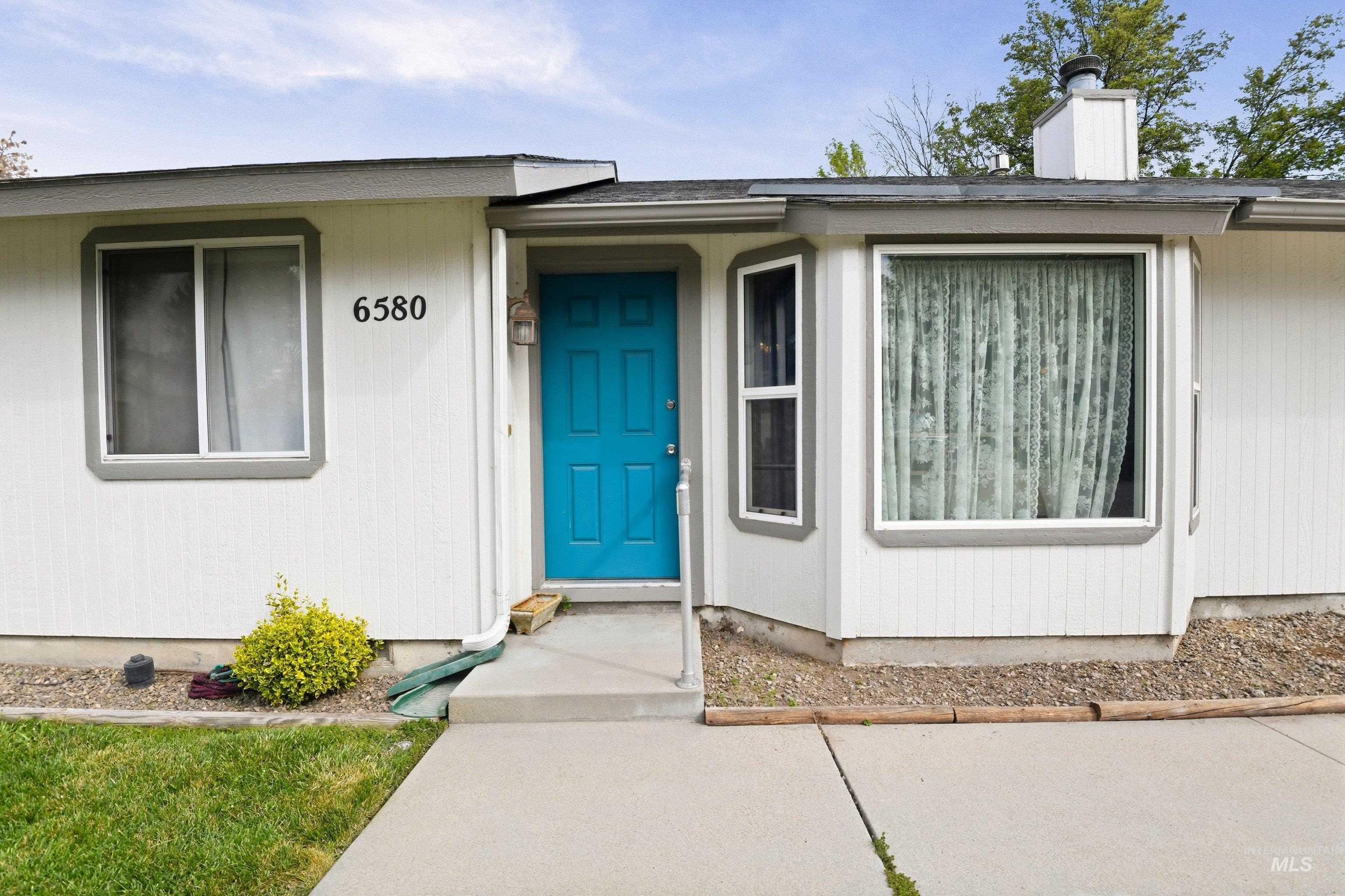 Property entrance featuring a chimney