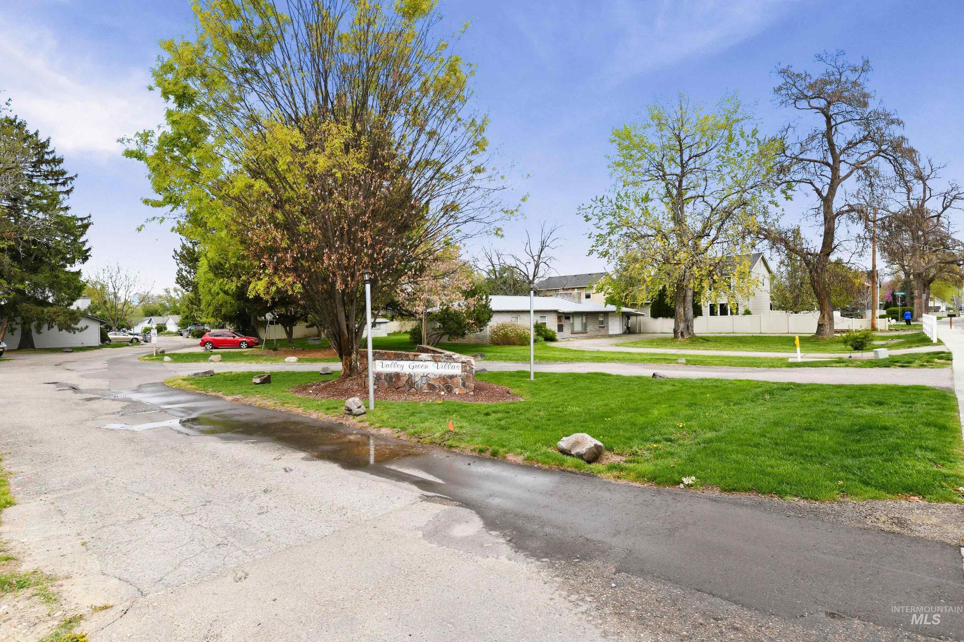 View of asphalt road with a residential view
