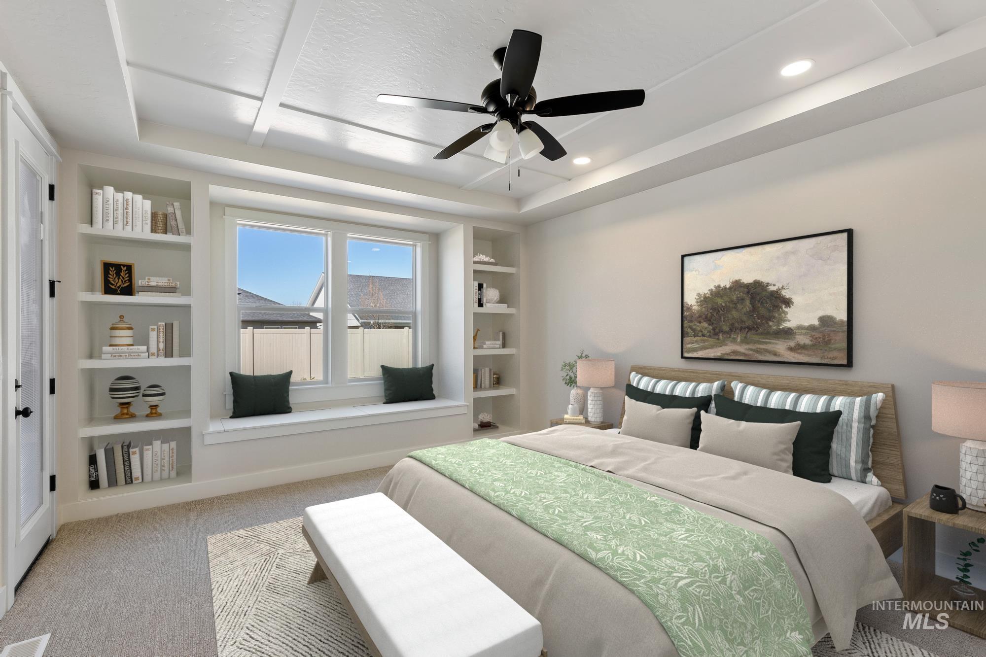 Bedroom with light carpet, a tray ceiling, and ceiling fan