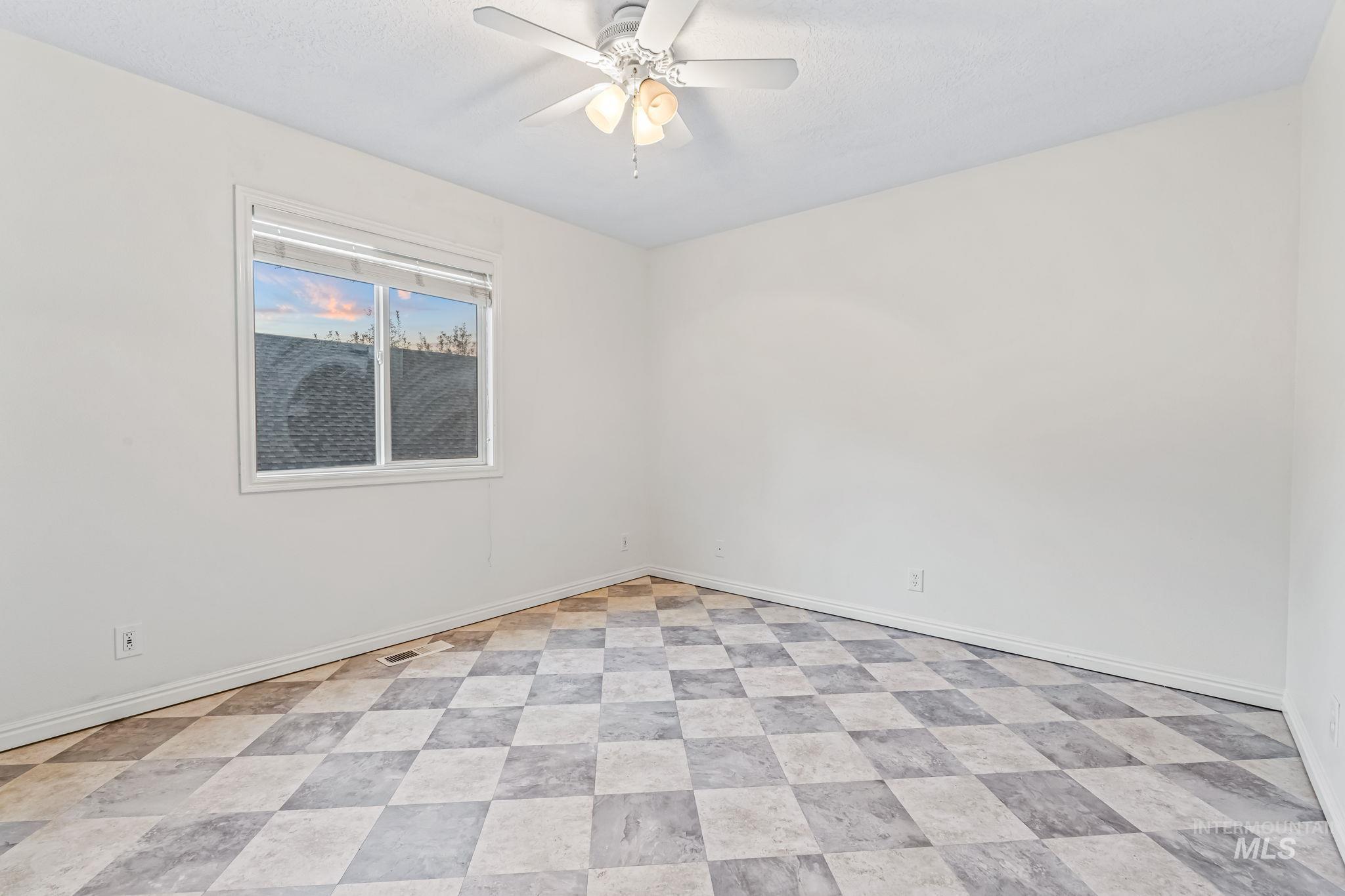 Bedroom with baseboards and ceiling fan