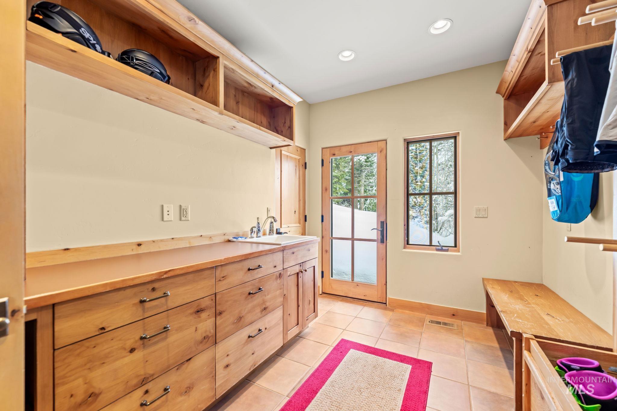 Mudroom featuring light tile patterned flooring and recessed lighting