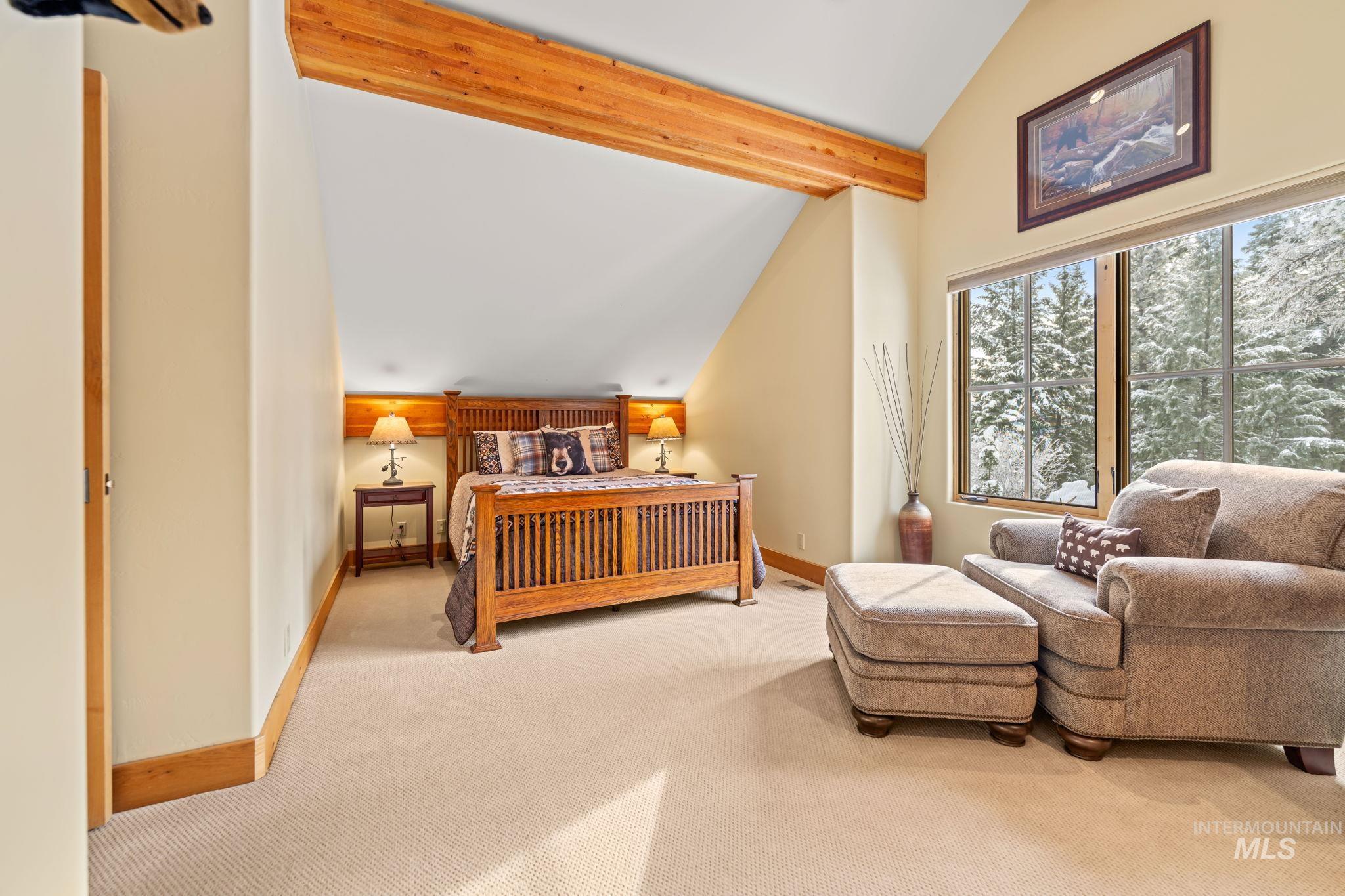 Bedroom featuring carpet flooring and baseboards