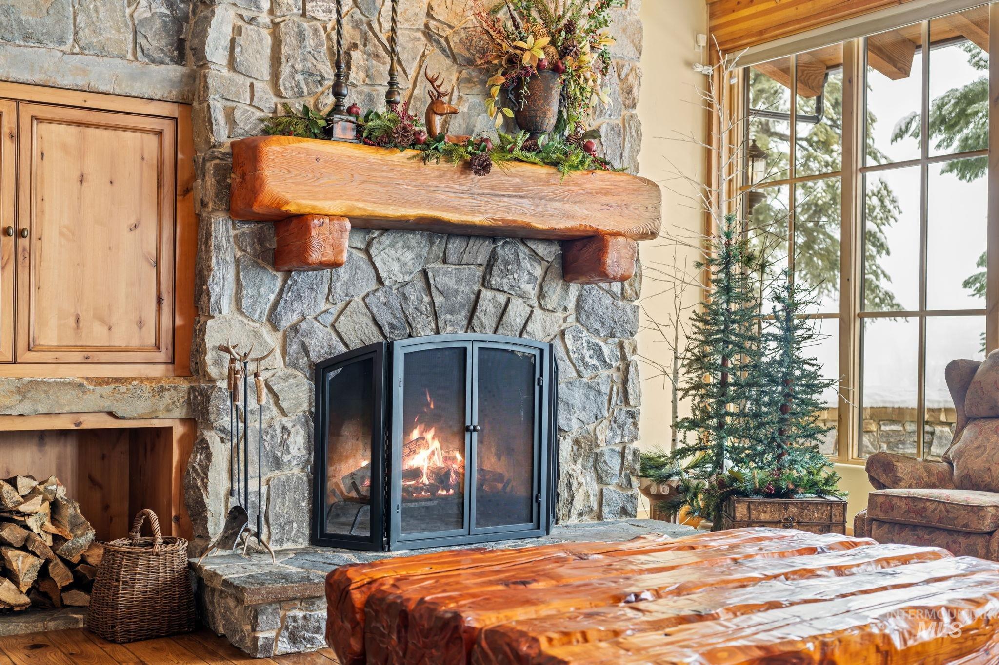 Detailed view of a fireplace and wood finished floors