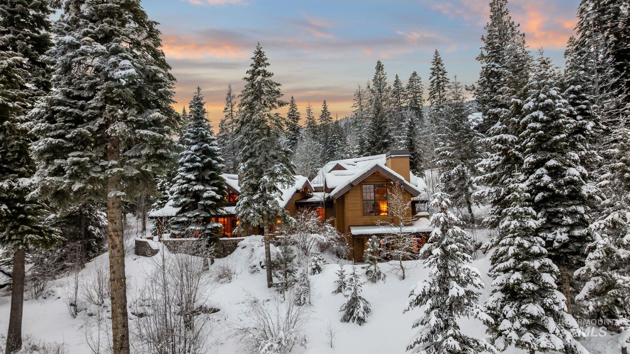 View of snowy exterior featuring a chimney