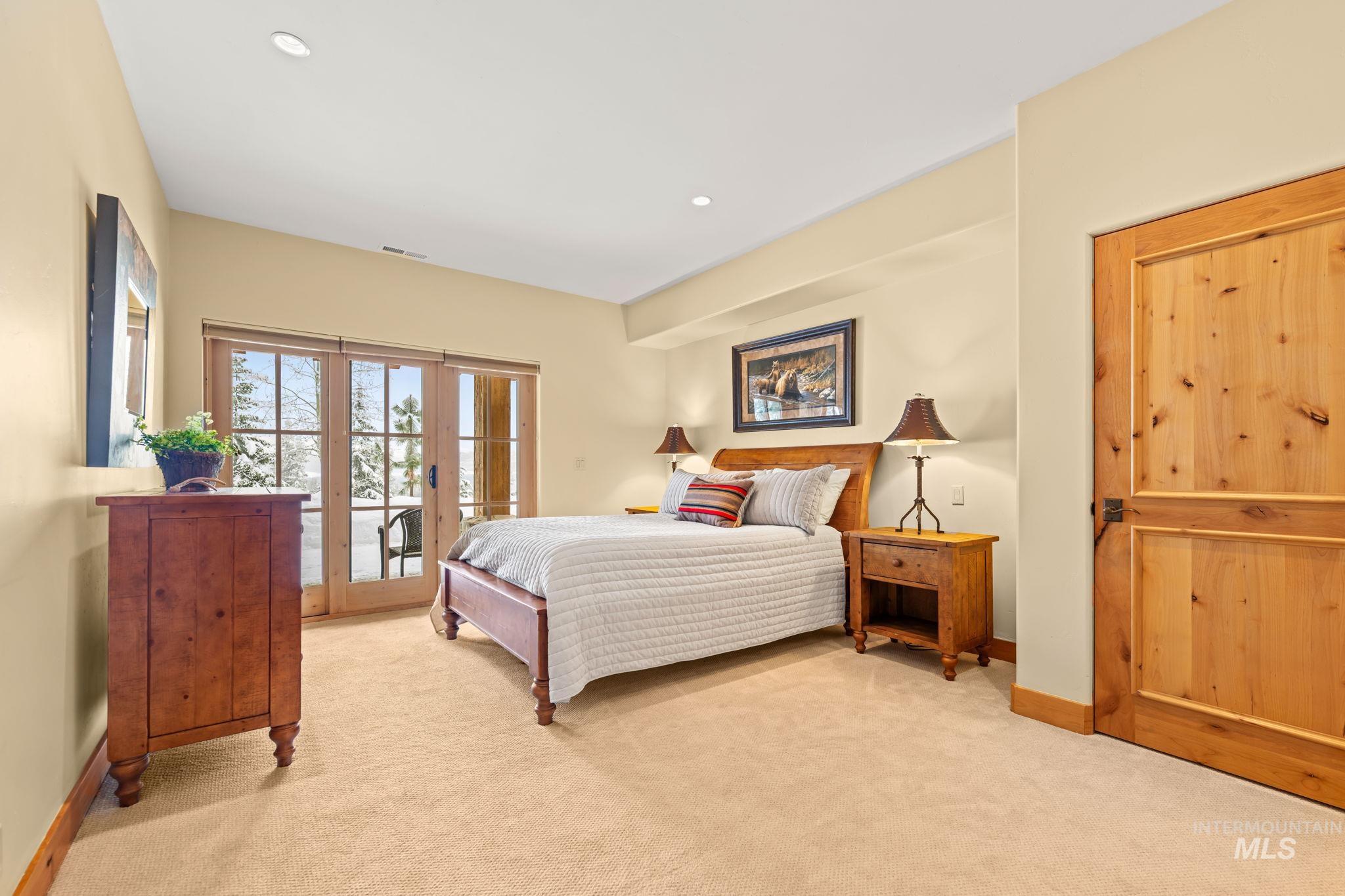Bedroom featuring carpet flooring, access to exterior, french doors, and recessed lighting